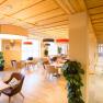 Lobby of the JUFA Hotel Annaberg with modern furniture and large lamps.
