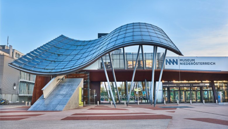 Entrance to the Museum of Lower Austria with modern architecture and curved glass roof.